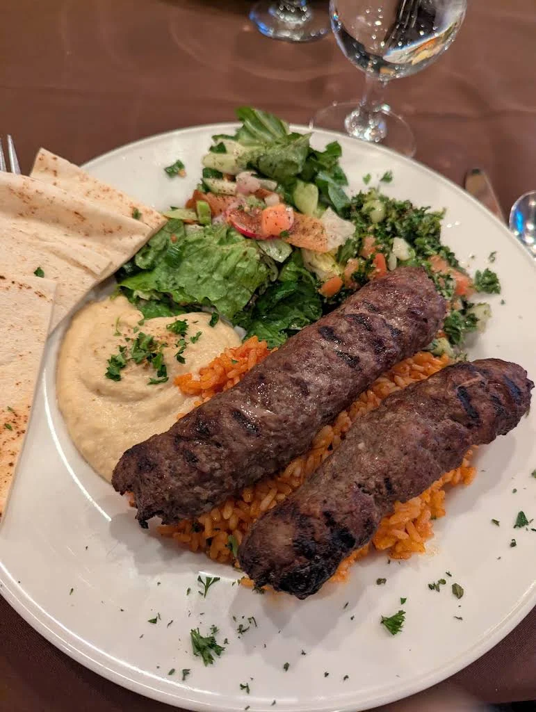 Chargrilled kafta kebabs with rice, hummus, pita and salad
